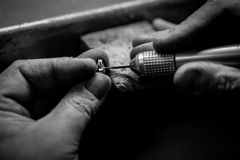 Hands crafting jewelry